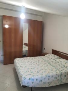 Postel nebo postele na pokoji v ubytování Artemide Residence Acquaviva