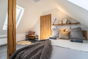 a bedroom with a bed in a attic at Podkrovní apartmán Studnice in Nové Město na Moravě