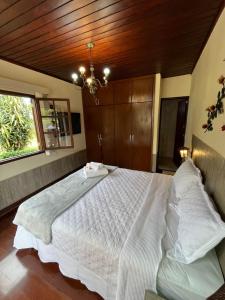 Postel nebo postele na pokoji v ubytování Recanto dos Vianas
