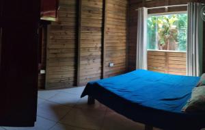 Giường trong phòng chung tại Morada Ipê Amarelo