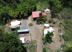 an aerial view of a house in the woods at La tente de Cléa in Salazie