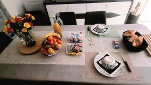 a table with a bunch of food on it at Pleuca'Dort in Pleucadeuc