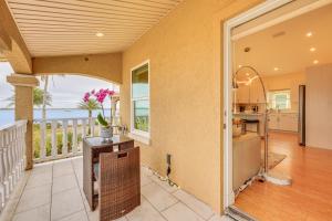 an open kitchen and dining room with a view of the ocean at Watch Dolphins St Augustine Gem Near Downtown! in Saint Augustine
