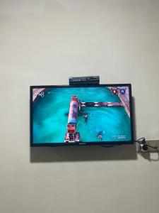 a flat screen tv hanging on a wall at Nicat in Quba