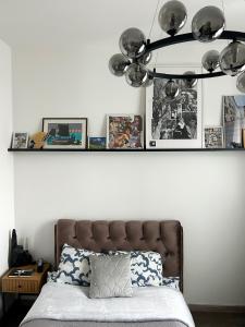 a shelf above a bed in a bedroom at Bonnie & Clyde's hideout in Rīga