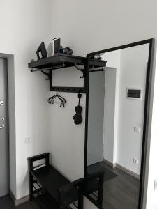 a mirror in a room with a shelf and a chair at Bonnie & Clyde's hideout in Rīga +18 photos