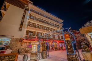 a building with a bunch of balconies on it at Hôtel du Centre in Valloire
