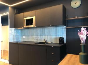 Kuchyň nebo kuchyňský kout v ubytování Appartement Design aux Porte de Paris