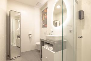Koupelna v ubytování EA- Design Apartment nähe Hauptplatz