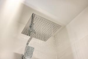 Koupelna v ubytování EA- Design Apartment nähe Hauptplatz