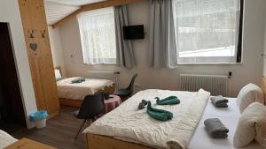 Postel nebo postele na pokoji v ubytování Pension INGE