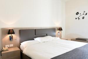 Postel nebo postele na pokoji v ubytování Hotel Venezia