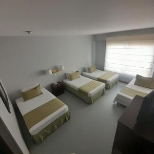 Postel nebo postele na pokoji v ubytování Hotel Internacional La Triada
