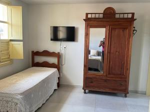 Ένα ή περισσότερα κρεβάτια σε δωμάτιο στο Casa Ouro no centro de Diamantina