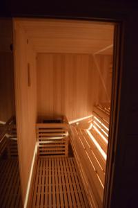 a walkway in a room with a glass door at Domki Na Dobrym Kursie in Jastrzębia Góra +39 photos