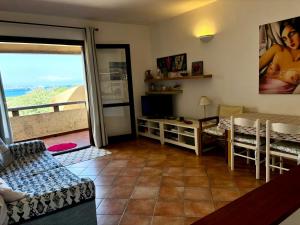 a living room with a view of the ocean at Apartment Vista Mare - Palau in Palau