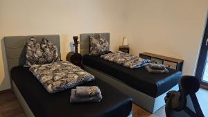 a room with two beds and a guitar in it at Ferienwohnung Lehmann 2 in Wolfenbüttel