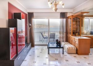 a living room with a view of the ocean at Vaggelis Sea View House Salamina in Eantio