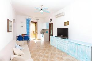 Μια τηλεόραση ή/και κέντρο ψυχαγωγίας στο Splendido Appartamento in pieno Centro Dell'Isola