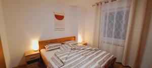 Postel nebo postele na pokoji v ubytování Biba House
