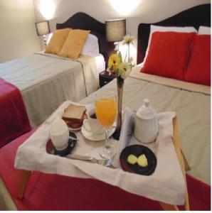 Postel nebo postele na pokoji v ubytování Casa Mendoza Inn