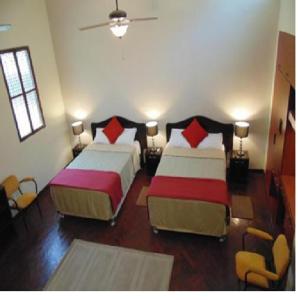 Postel nebo postele na pokoji v ubytování Casa Mendoza Inn