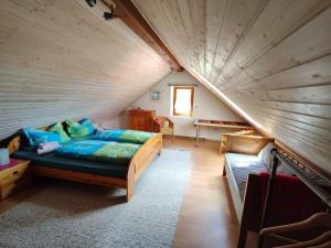 a large room with a couch in a attic at Große, gemütliche Wohnung in dörflicher Idylle in Breitenbach am Herzberg