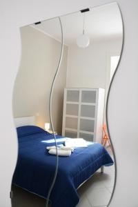 Ein Bett oder Betten in einem Zimmer der Unterkunft Grigio Pesca