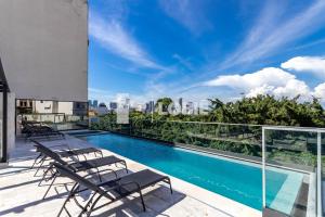 a swimming pool on the roof of a building at Lobie Gloria Del'Art in Rio de Janeiro +10 photos