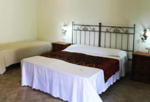 Кровать или кровати в номере L' Antico Casale