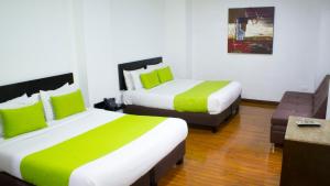 Postel nebo postele na pokoji v ubytování Hotel macao colombia + 23 fotografií