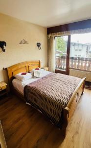 Posteľ alebo postele v izbe v ubytovaní Appartement 2 pieces LE SAPPORO