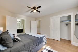 a bedroom with a bed and a ceiling fan at Less Than 2 Mi to ECU Cozy Greenville Getaway for Fall in Greenville