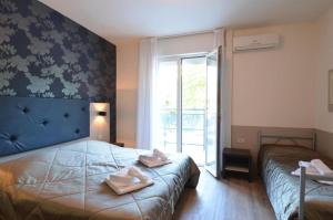 Postel nebo postele na pokoji v ubytování Hotel Gambrinus