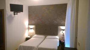 Postel nebo postele na pokoji v ubytování Hotel Gambrinus