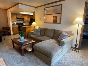 a living room with a couch and a table at Snowed Inn in Brian Head