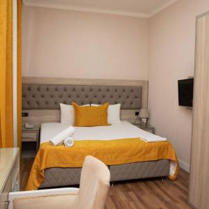Postel nebo postele na pokoji v ubytování Hotel Empire Business Baku