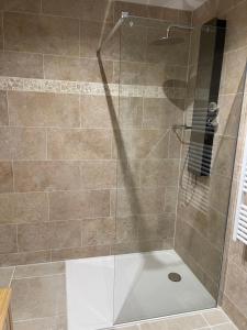 a bathroom with a shower with a glass door at Le domaine du Martinet in Salles +19 photos