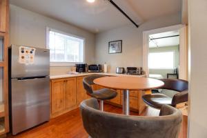 a kitchen with a round table and chairs in a kitchen at Sisters Retreat Upper Lower in Sisters