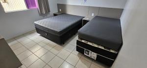 Giường trong phòng chung tại Jardim das Thermas apt para até 5 pessoas +10 ảnh