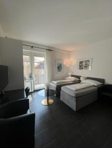 A bed or beds in a room at Seefeld Residenz
