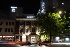 a building on a city street at night at Auckland Boutique Capsule in Auckland