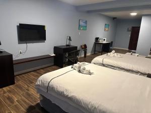 Postel nebo postele na pokoji v ubytování Enjoy Hotel