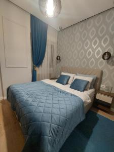 Postel nebo postele na pokoji v ubytování Stefan Lux Apartment