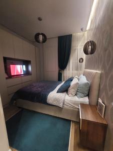 Postel nebo postele na pokoji v ubytování Stefan Lux Apartment