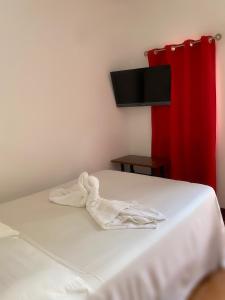 Postel nebo postele na pokoji v ubytování Hospedaje y Cafe Ruiz