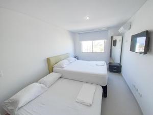 Postel nebo postele na pokoji v ubytování Acogedores apartamentos en el Rodadero RS By Bedviajes + 43 fotografií