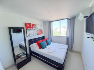 Postel nebo postele na pokoji v ubytování Acogedores apartamentos en el Rodadero RS By Bedviajes