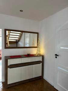 a dressing room with a mirror and a dresser at Gorgeous nook in Góry Wysokie