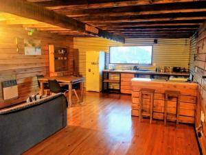 a large kitchen with a table and a dining room at Pizarra Escondida in El Chalten +12 photos